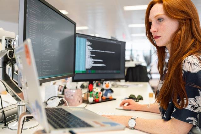 IT worker in front of a computer